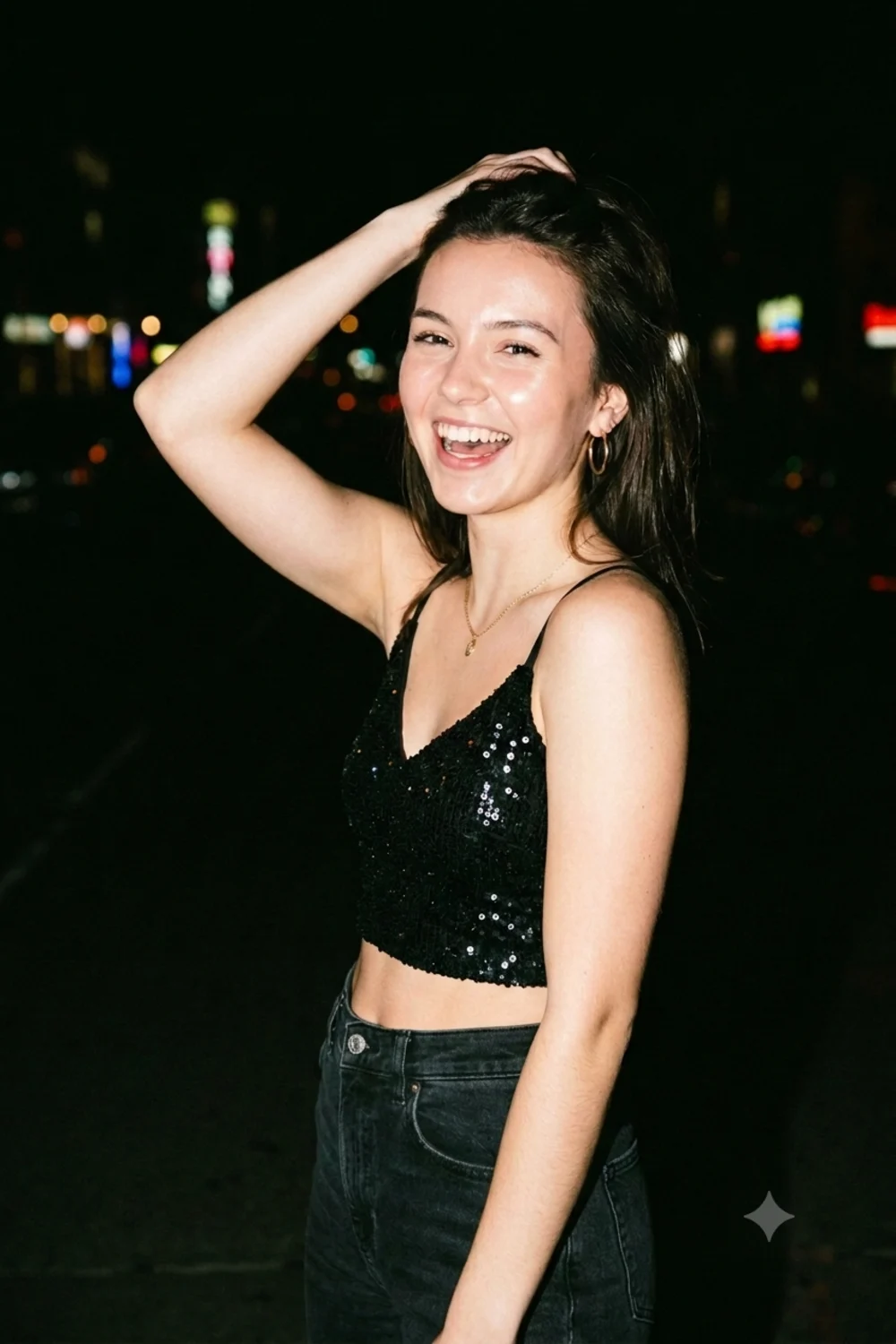 A candid direct-flash night-out photo of a person with a dark blurred city background